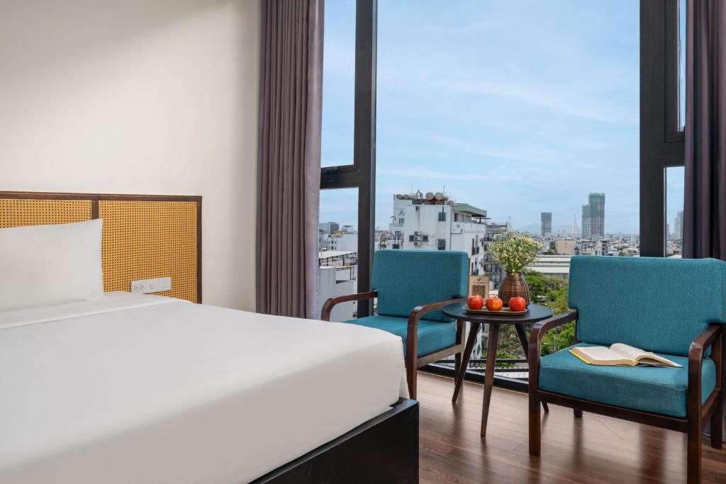 Postel nebo postele na pokoji v ubytování Platinum Danang Hotel