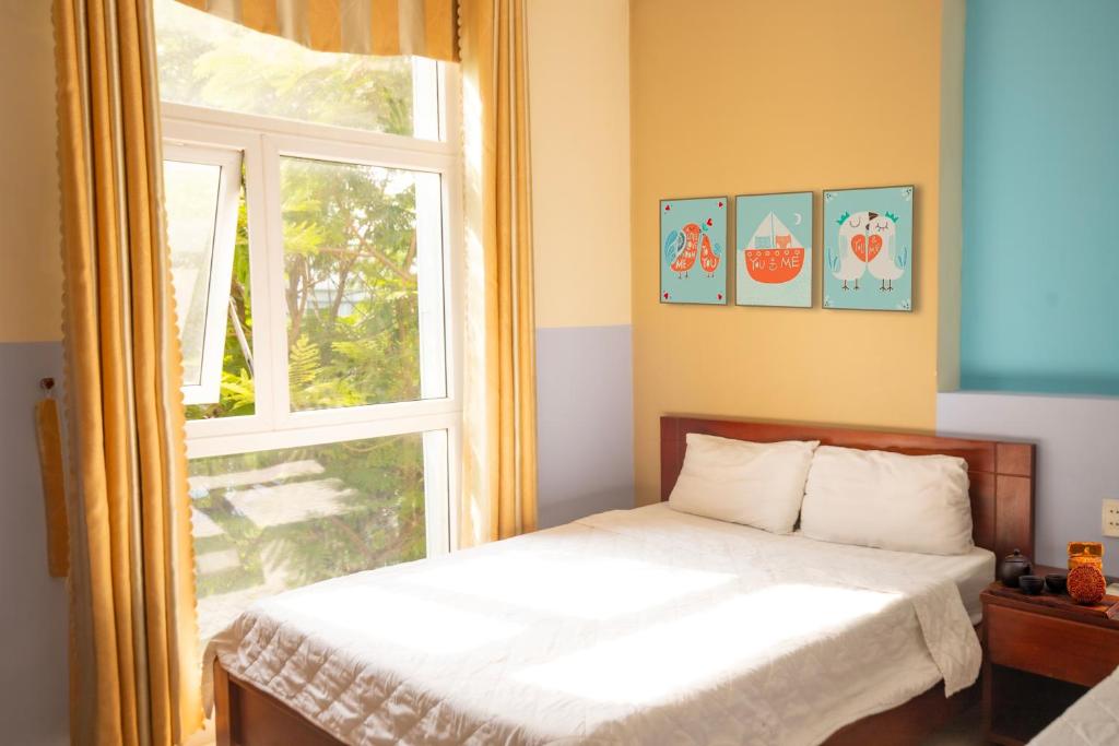 Postel nebo postele na pokoji v ubytování Smile hotel