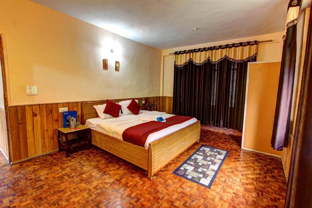 Voodi või voodid majutusasutuse The Ambience Resort, Nainital - A Hidden Gem Away From City Hustle toas