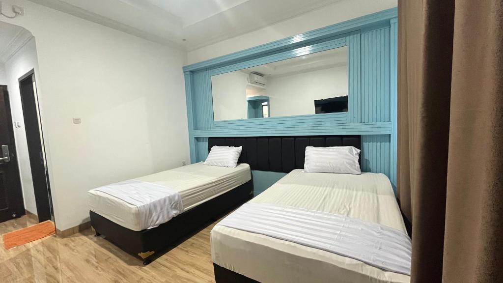 Ully Hotel Solok - Deluxe Doppel- Oder Zweibettzimmer