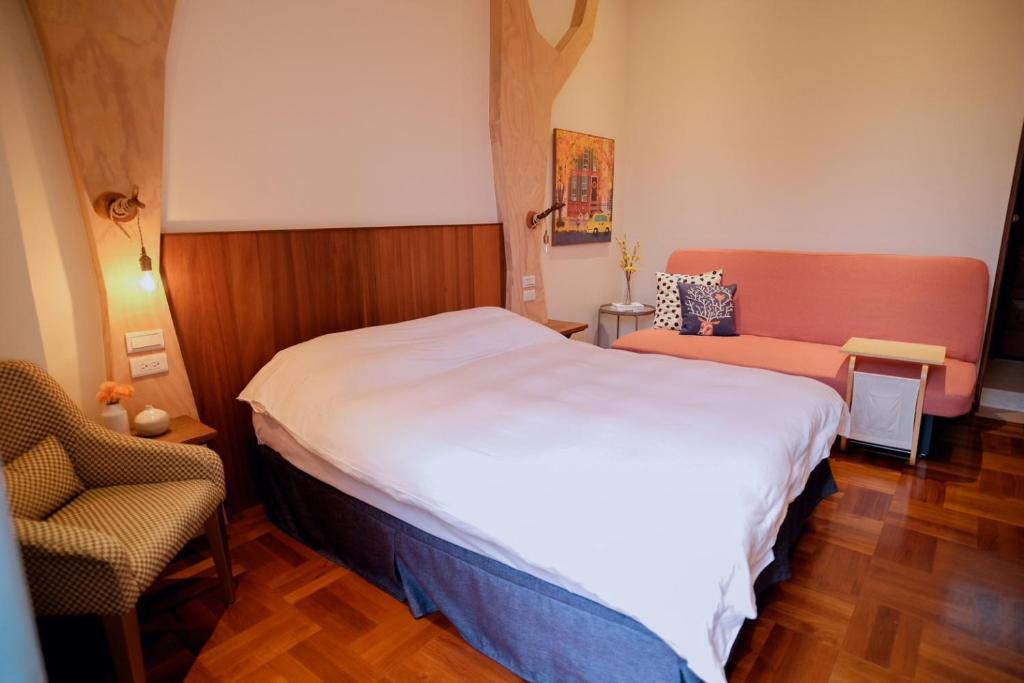 Postel nebo postele na pokoji v ubytování Yun Tien Feng Chuan B&B