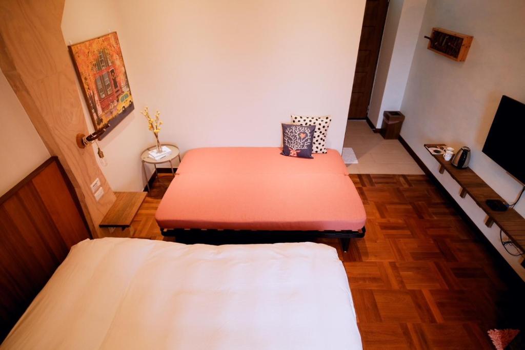 Postel nebo postele na pokoji v ubytování Yun Tien Feng Chuan B&B