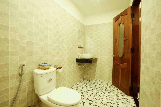 Vannituba majutusasutuses Coconut Garden Homestay