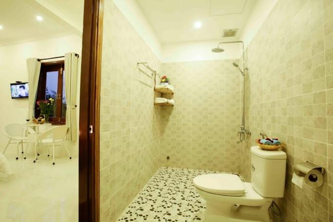 Vannituba majutusasutuses Coconut Garden Homestay
