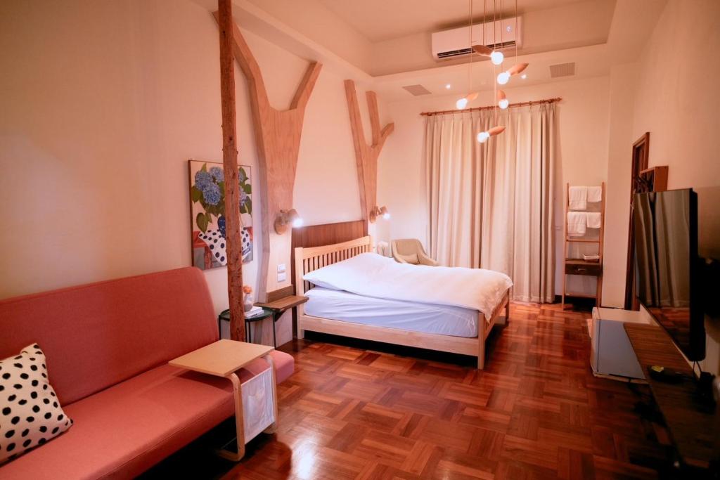 Postel nebo postele na pokoji v ubytování Yun Tien Feng Chuan B&B