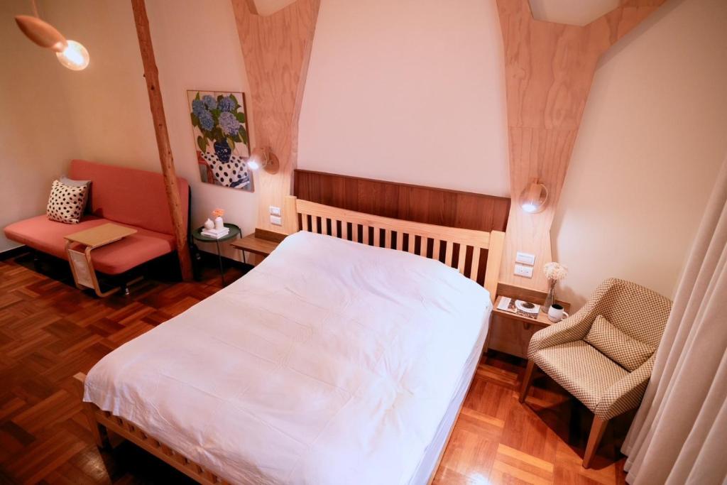 Postel nebo postele na pokoji v ubytování Yun Tien Feng Chuan B&B