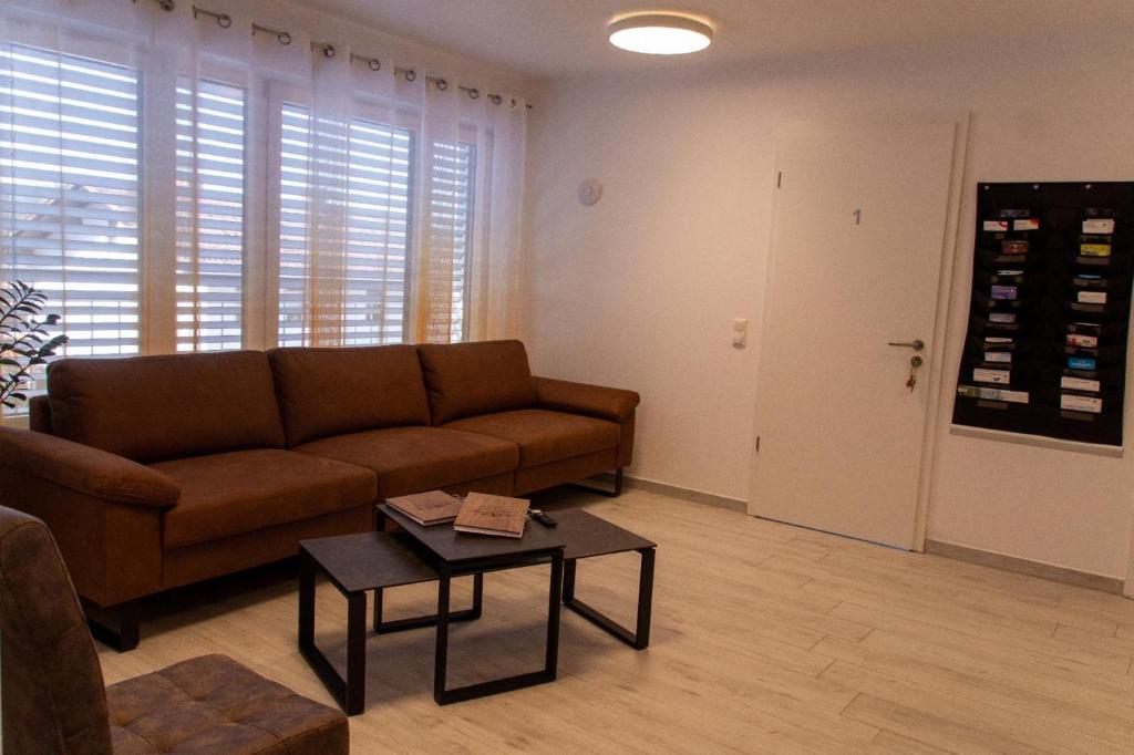a living room with a couch and a table at Ferienwohnung Kuss in Schönberg