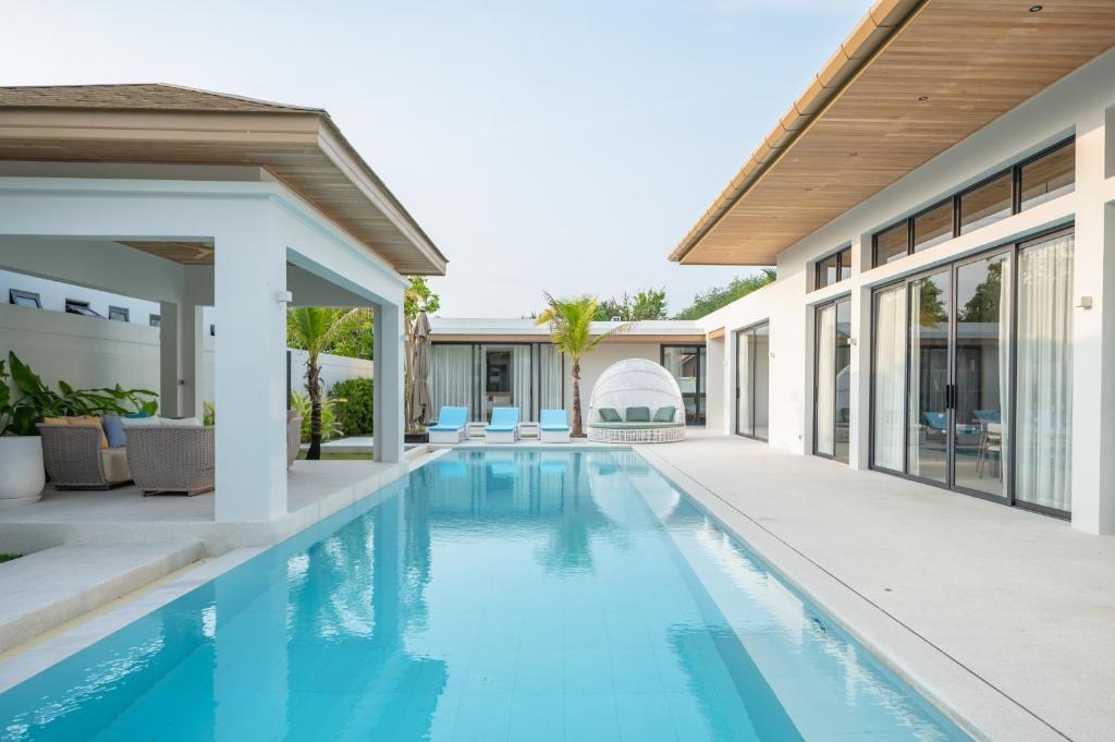 an image of a swimming pool in a house at Mouana Breeze Mai Khao 5-bedroom Pool Villa 9910 in Mai Khao Beach