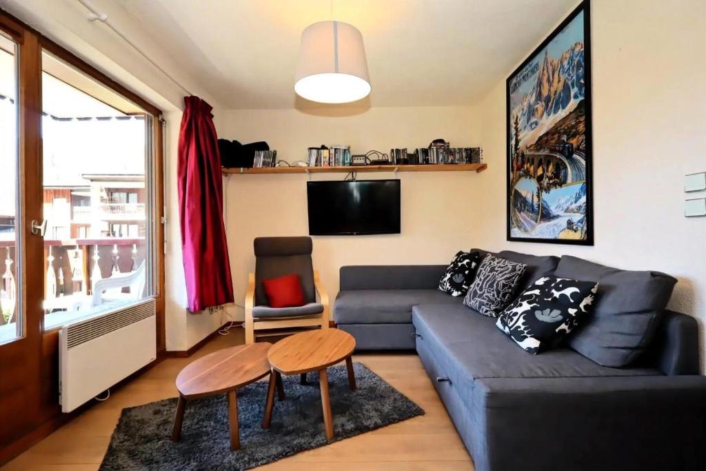 a living room with a couch and a table at Résidence Les Houches Villages - Houches Village B23 MAE-6424 in Les Houches