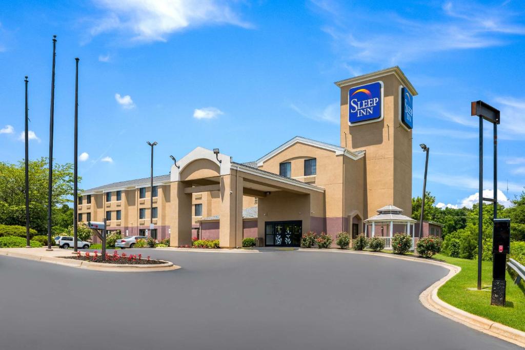 a hotel with a sign on the front of a building at Sleep Inn Statesville I-40 in Statesville