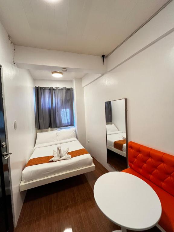 Postel nebo postele na pokoji v ubytování Rangya Hotel