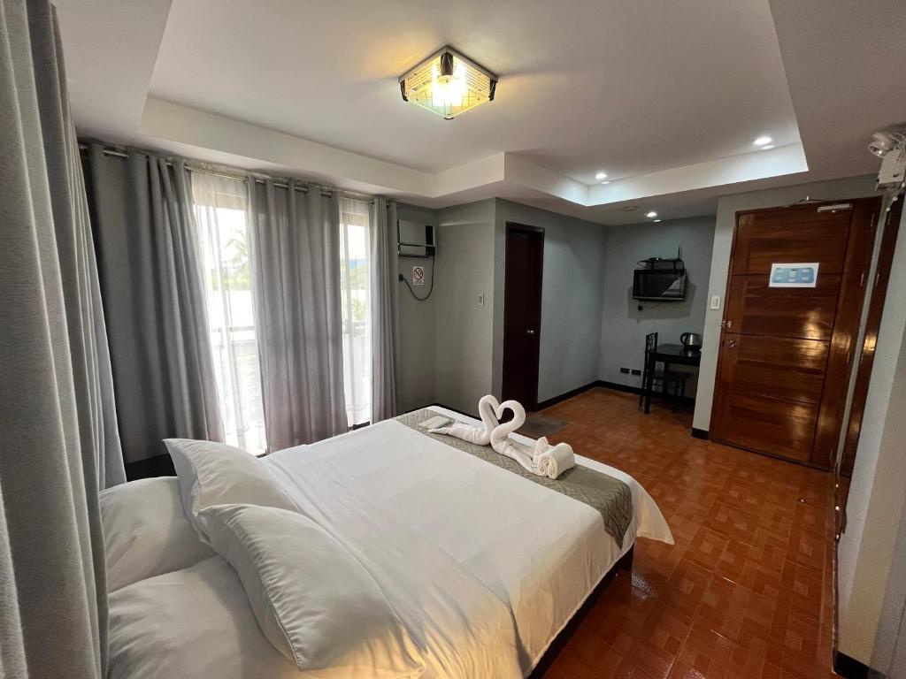 Postel nebo postele na pokoji v ubytování Rangya Hotel