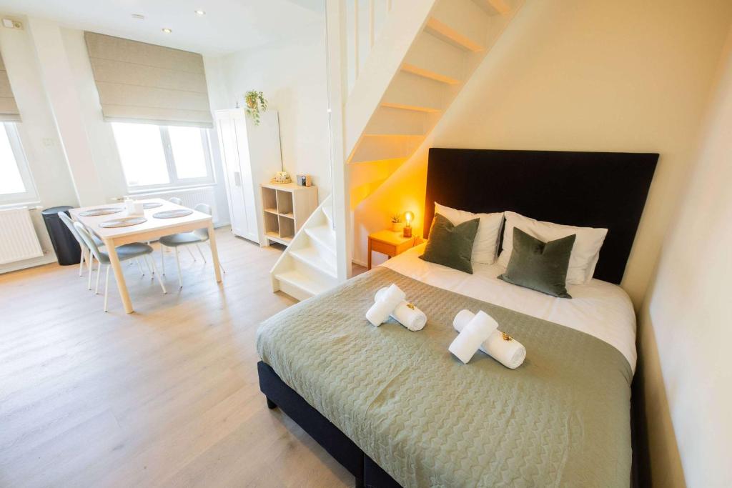 a bedroom with a bed with two pillows on it at Smart 50m2 One Bedroom Apartment - VW140C in Eindhoven