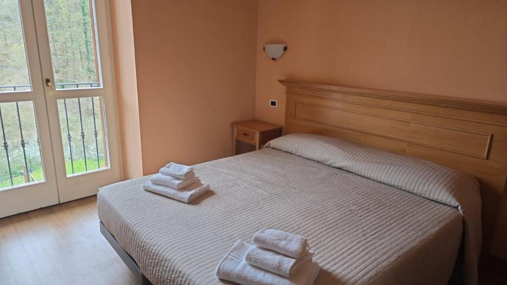 Postel nebo postele na pokoji v ubytování Albergo Minetto