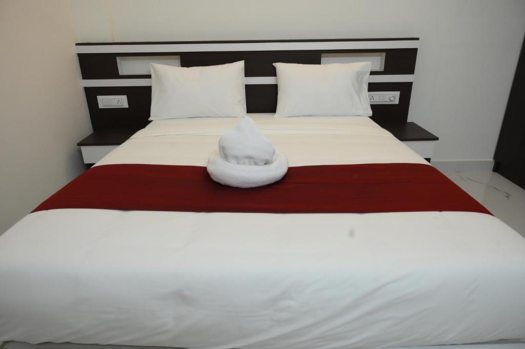 Postel nebo postele na pokoji v ubytování CAT'S EYE Hotel
