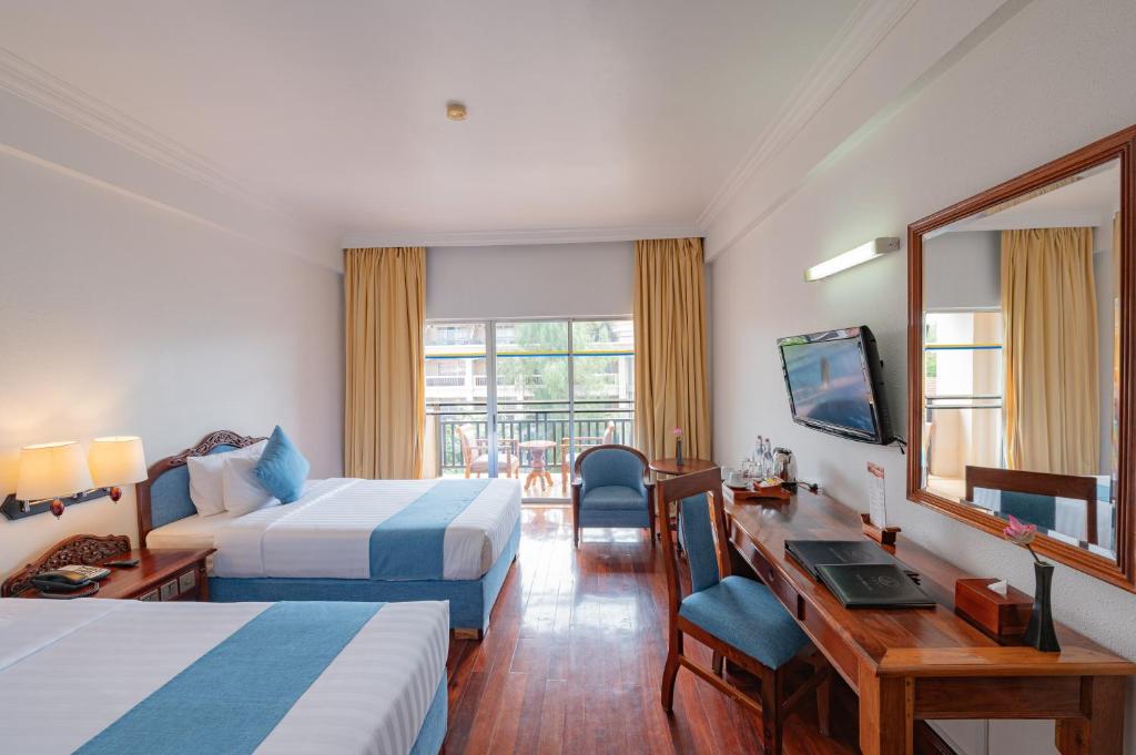 Postel nebo postele na pokoji v ubytování Hotel Somadevi Angkor Resort & Spa