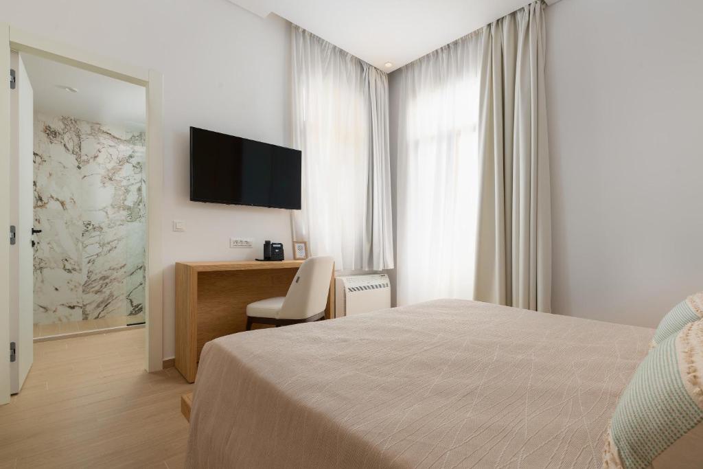 TV a/nebo společenská místnost v ubytování The 12th City Hotel