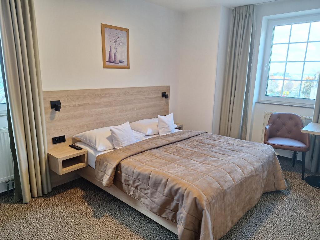 Postel nebo postele na pokoji v ubytování Hotel Avion