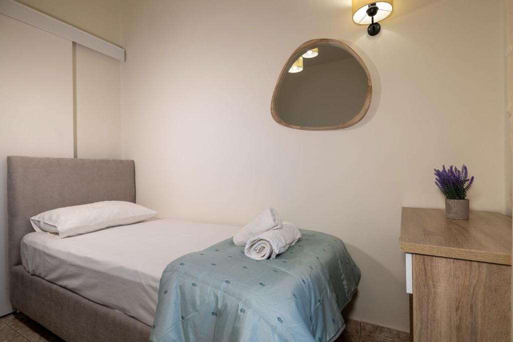 Postel nebo postele na pokoji v ubytování Kamara Apartments