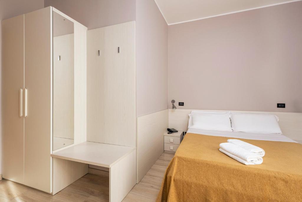 Кровать или кровати в номере Hotel Mondial