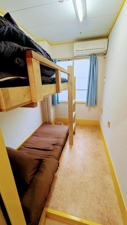 Palanda nebo palandy na pokoji v ubytování Joe Backpackers