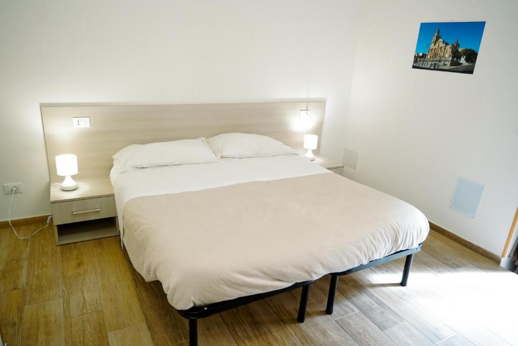Postel nebo postele na pokoji v ubytování alex rooms