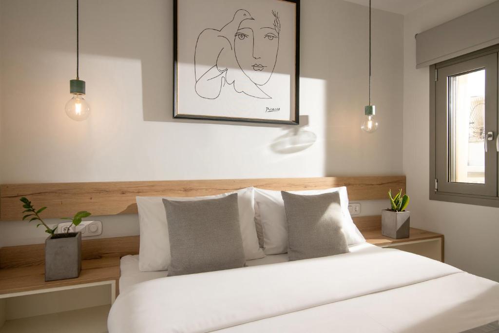 Postel nebo postele na pokoji v ubytování The Central Boutique Apartments