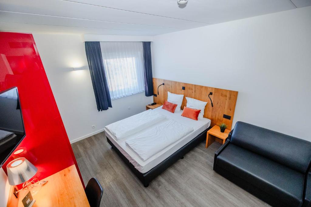 Voodi või voodid majutusasutuse Hotel Corsendonk Viane toas