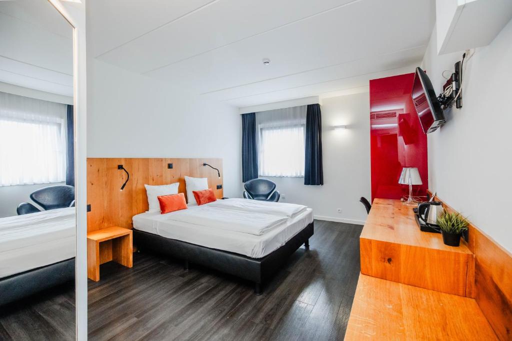 Voodi või voodid majutusasutuse Hotel Corsendonk Viane toas
