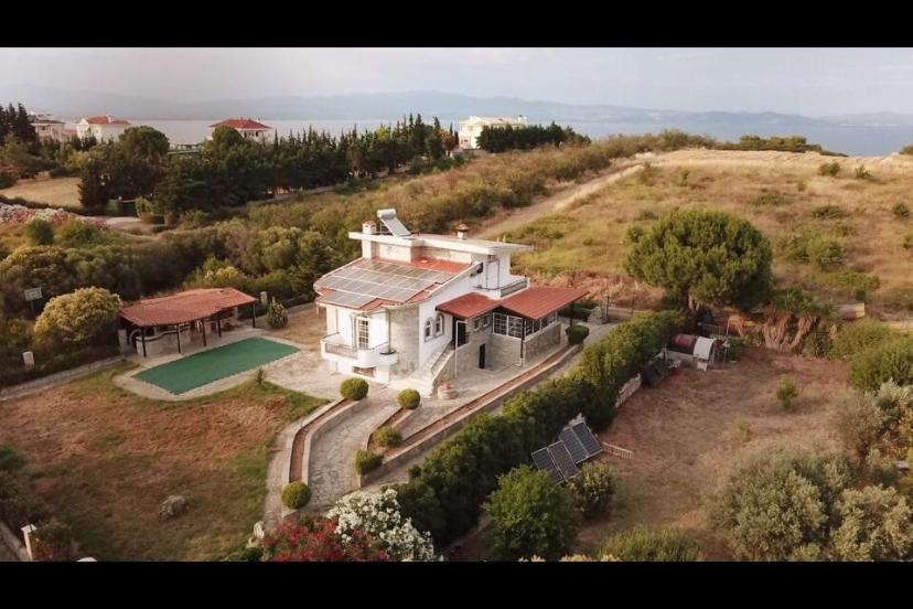 an aerial view of a house with a swimming pool at Stone Villa Nea Potidaia in Nea Potidaea