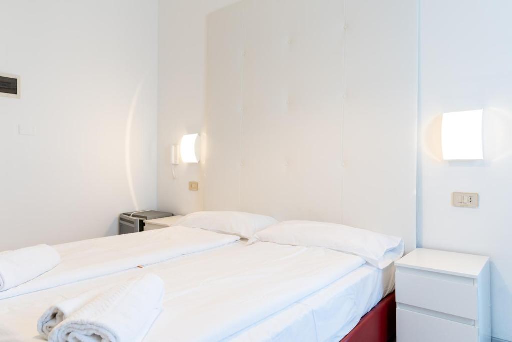 Postel nebo postele na pokoji v ubytování Hotel Regina