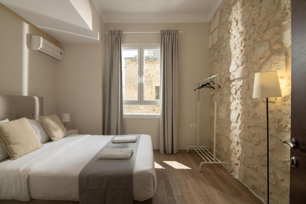 Postel nebo postele na pokoji v ubytování The Central Boutique Apartments