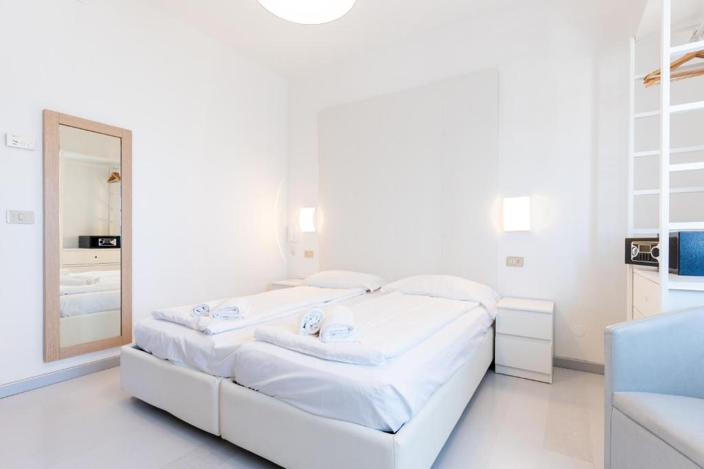 Postel nebo postele na pokoji v ubytování Hotel Regina