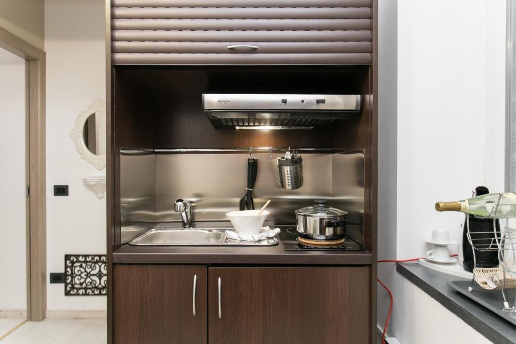 Kuchyň nebo kuchyňský kout v ubytování Aparthotel Dei Mercanti