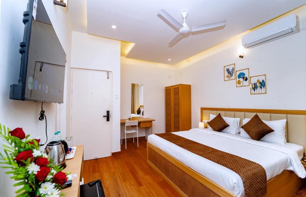 Postel nebo postele na pokoji v ubytování Maashpi Hotel & Resort, Candolim