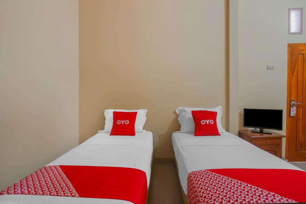 Postel nebo postele na pokoji v ubytování Collection O 89999 Hotel Bumi Kedaton Resort