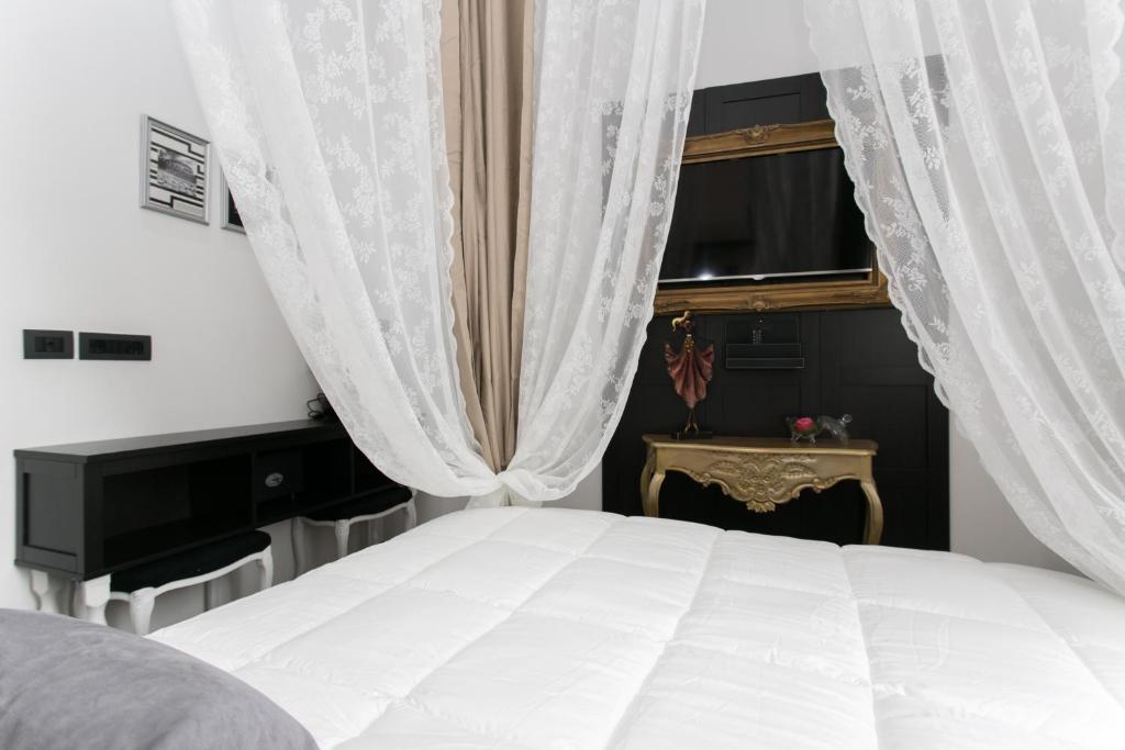 Postel nebo postele na pokoji v ubytování Aparthotel Dei Mercanti