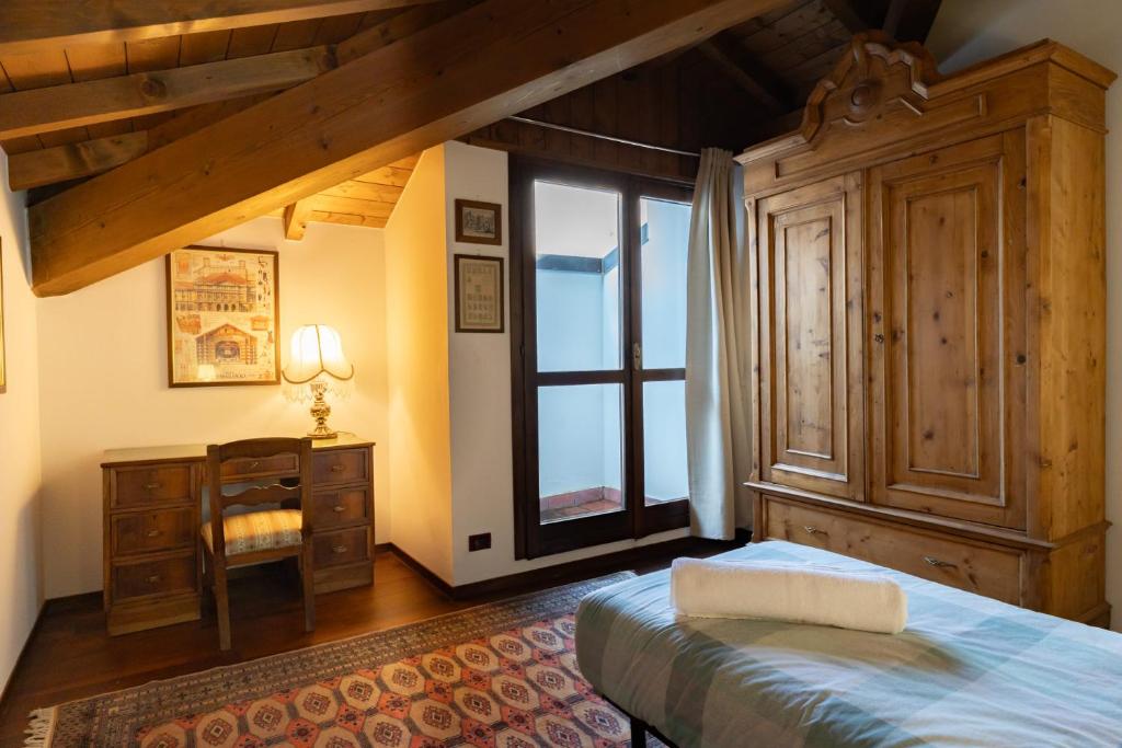 Postel nebo postele na pokoji v ubytování Luxury Apartment between Como Lake and Valsassina