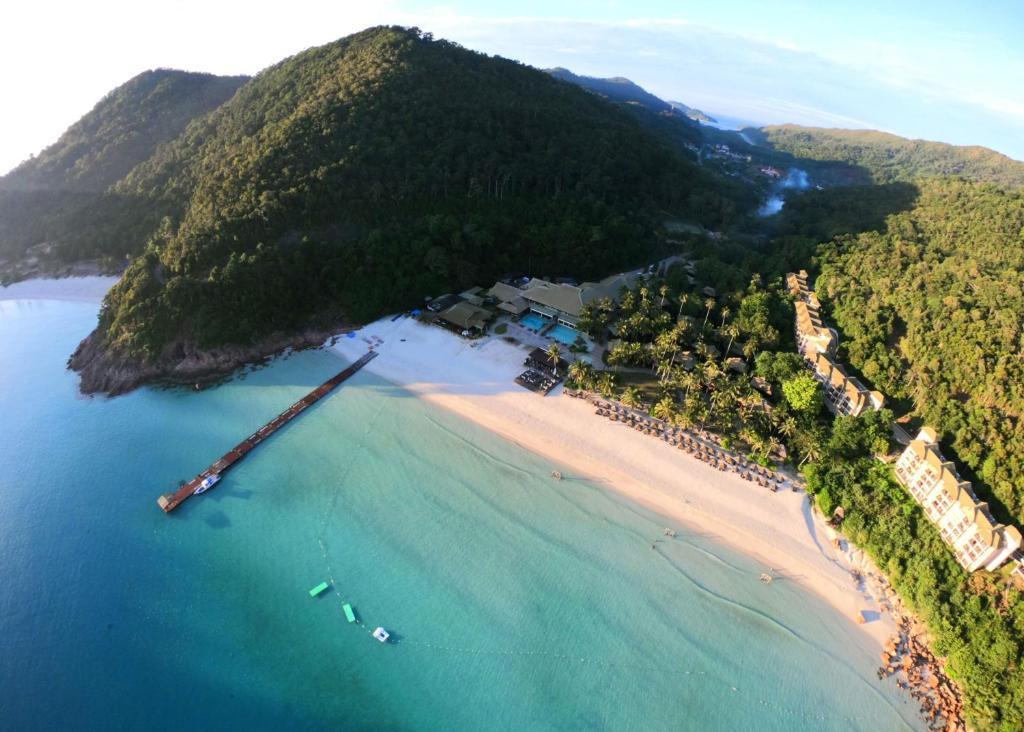 an aerial view of a beach with boats in the water at The Taaras Beach & Spa Resort in Redang Island