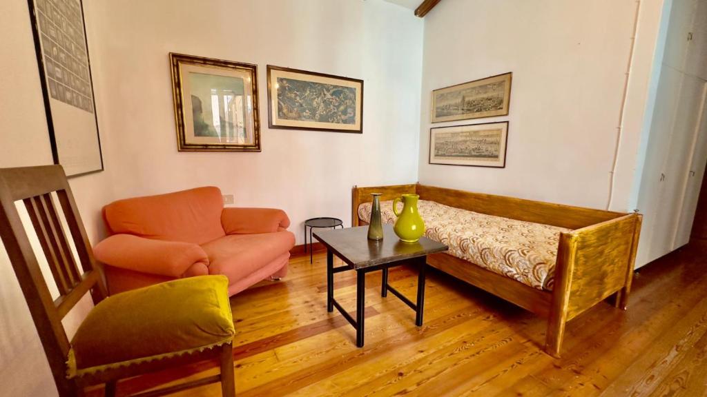 a living room with a couch and a chair at San Rocco in Venice