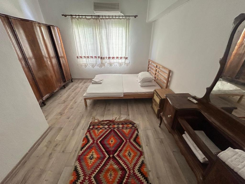Postel nebo postele na pokoji v ubytování Bayraktar Konağı City Center