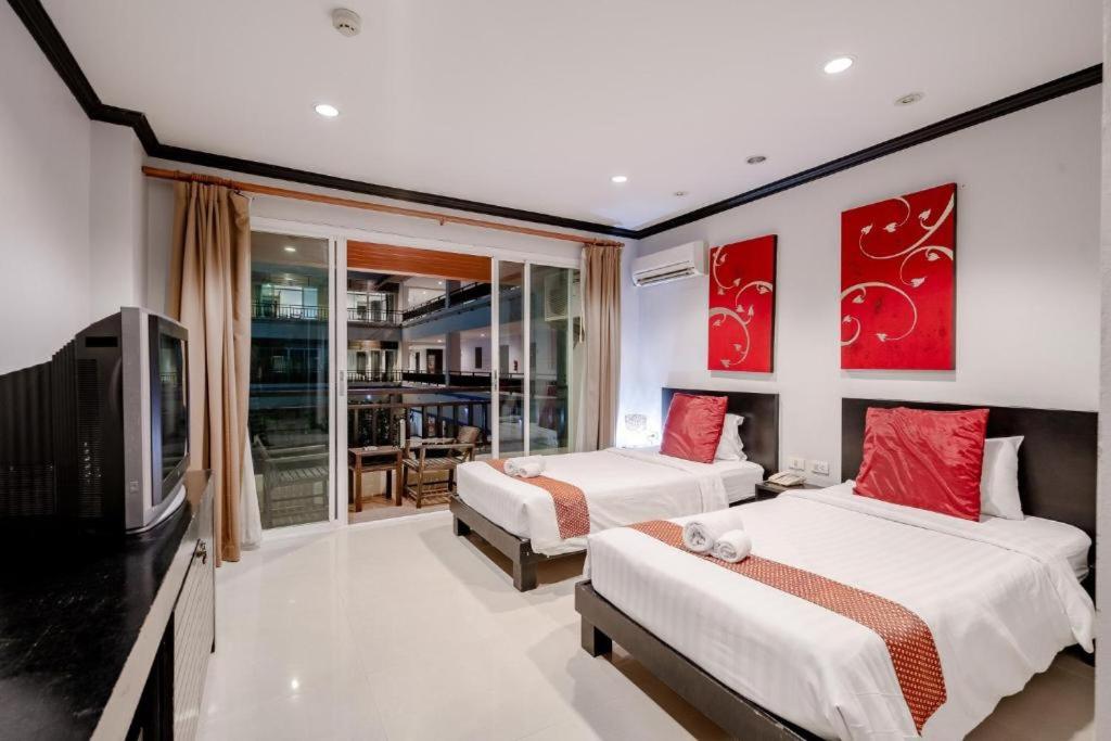 Postel nebo postele na pokoji v ubytování Napalai Resort Hua Hin