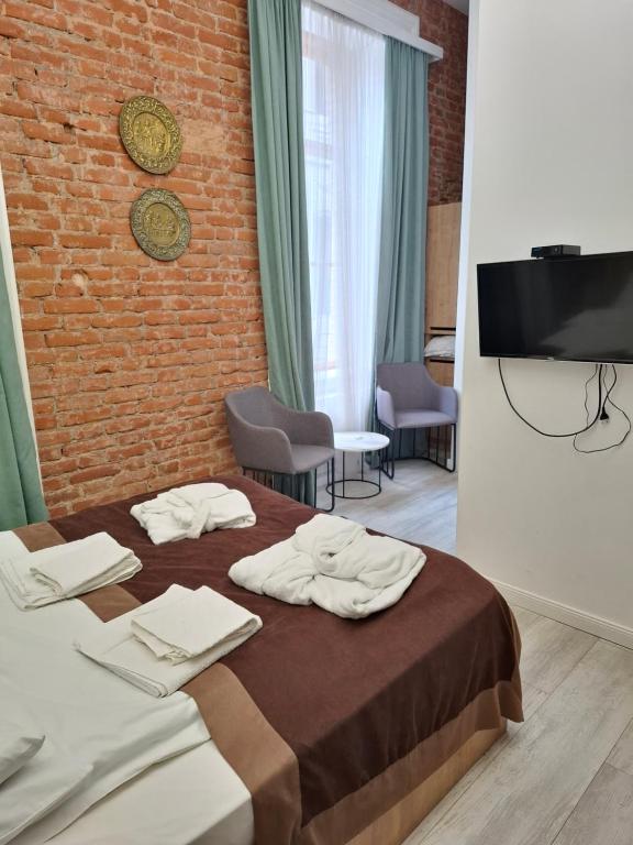 Postel nebo postele na pokoji v ubytování Nebula Boutique Hotel
