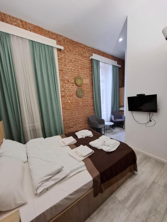 Postel nebo postele na pokoji v ubytování Nebula Boutique Hotel