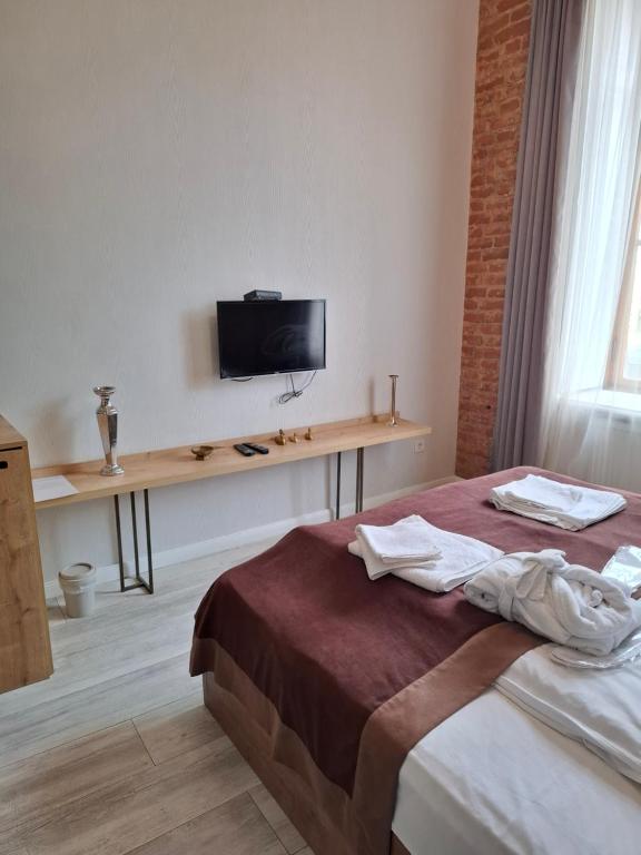 TV a/nebo společenská místnost v ubytování Nebula Boutique Hotel
