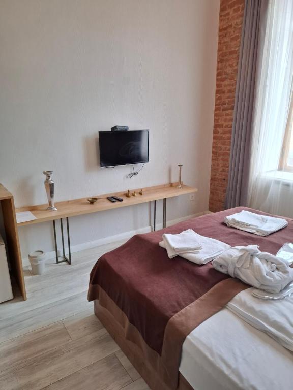 TV a/nebo společenská místnost v ubytování Nebula Boutique Hotel