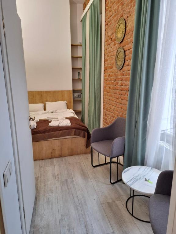 Postel nebo postele na pokoji v ubytování Nebula Boutique Hotel