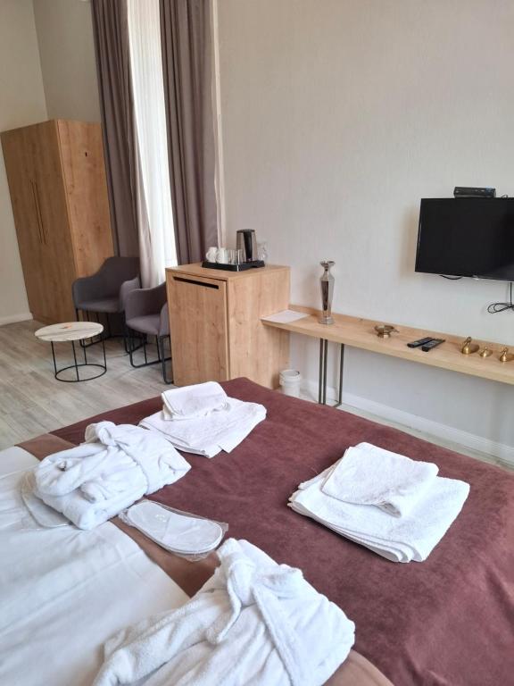 Postel nebo postele na pokoji v ubytování Nebula Boutique Hotel