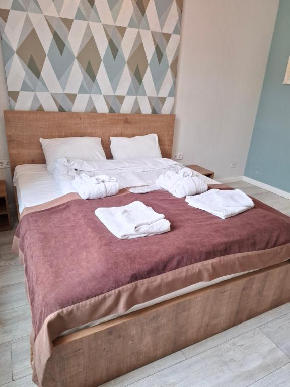 Postel nebo postele na pokoji v ubytování Nebula Boutique Hotel