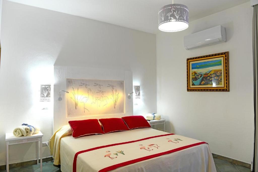 Postel nebo postele na pokoji v ubytování Alghero Sunrise
